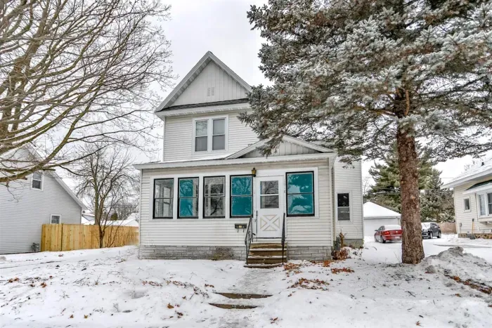 Charming two-story home with classic curb appeal, featuring a bright enclosed front porch, this cozy retreat offers a welcoming feel in every season.