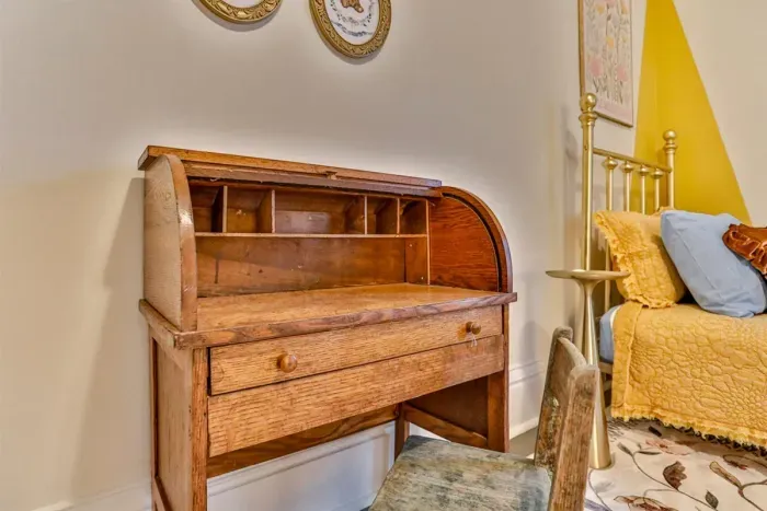 Includes a small writing desk, soft linens, and a calm, inviting atmosphere for kids.