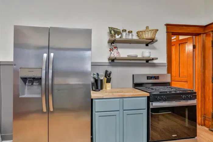 Bright, fully equipped kitchen with charming vintage details, updated appliances, and plenty of counter space.