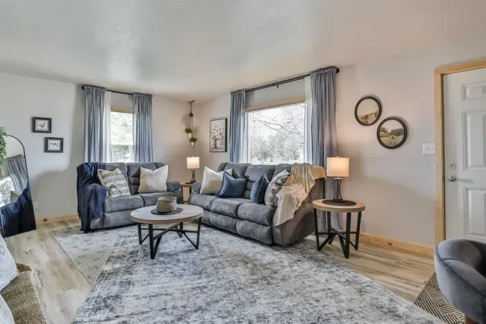 Well-lit living room with modern touches and relaxing ambiance.