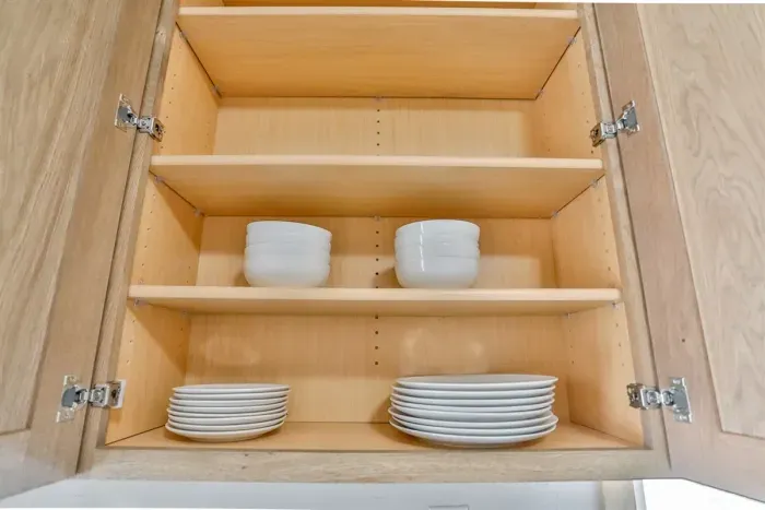 Compact kitchen with complete cookware and convenient layout.