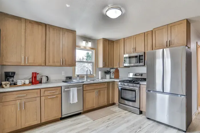 Spacious kitchen with dining setup, perfect for home-cooked meals.