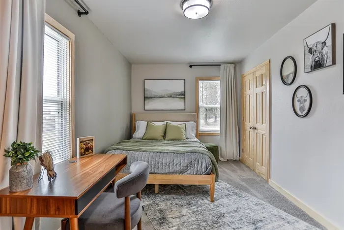 Elegant bedroom with hotel-quality bedding and a warm, relaxing ambiance.