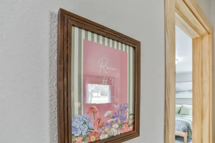 Simple yet stylish bedroom with comfortable bed, fresh air, and a homey feel.