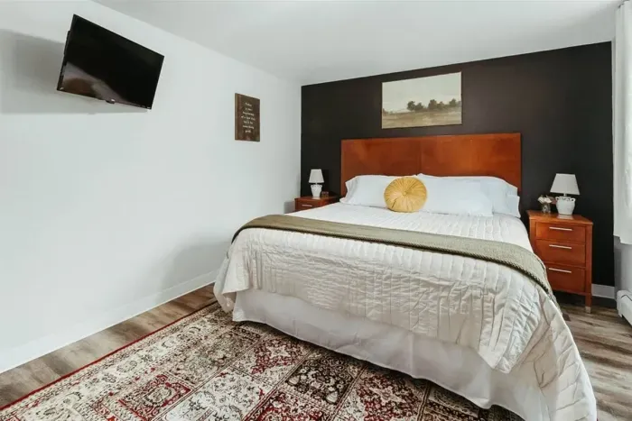 Your private sanctuary awaits – enjoy a restful night's sleep in our cozy bedroom.

Television