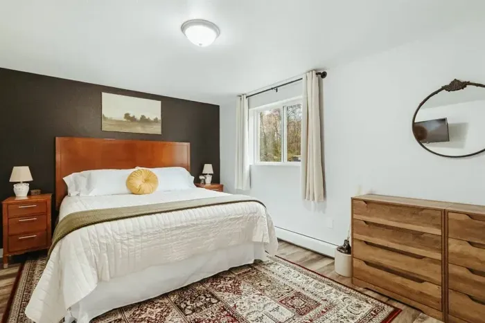 Your private sanctuary awaits – enjoy a restful night's sleep in our cozy bedroom.

Television