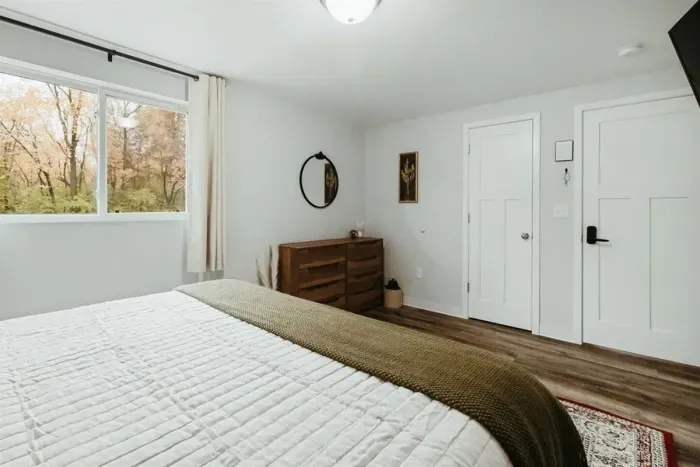 Your private sanctuary awaits – enjoy a restful night's sleep in our cozy bedroom.

Television