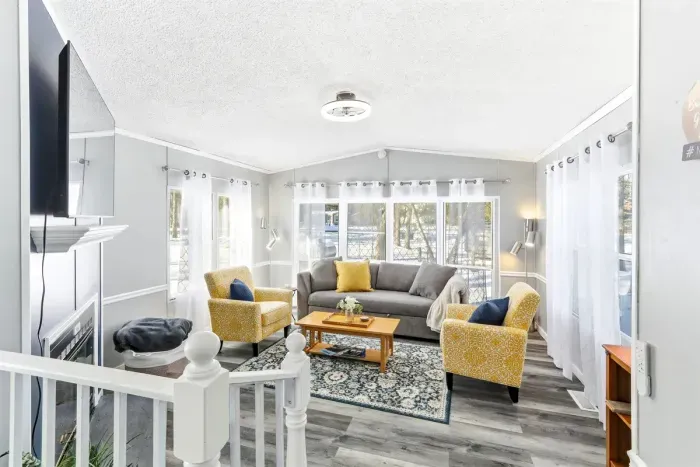 Bright and airy living room with large windows that fill the space with natural light.