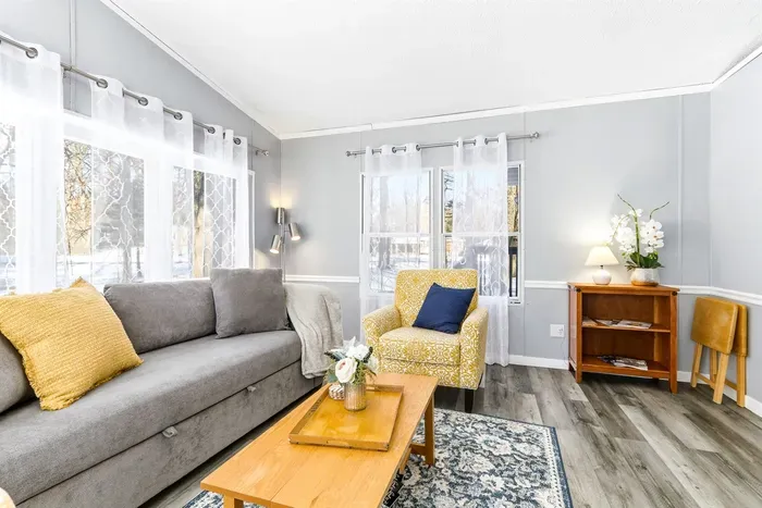 Modern living space with big windows that create a warm, inviting ambiance.