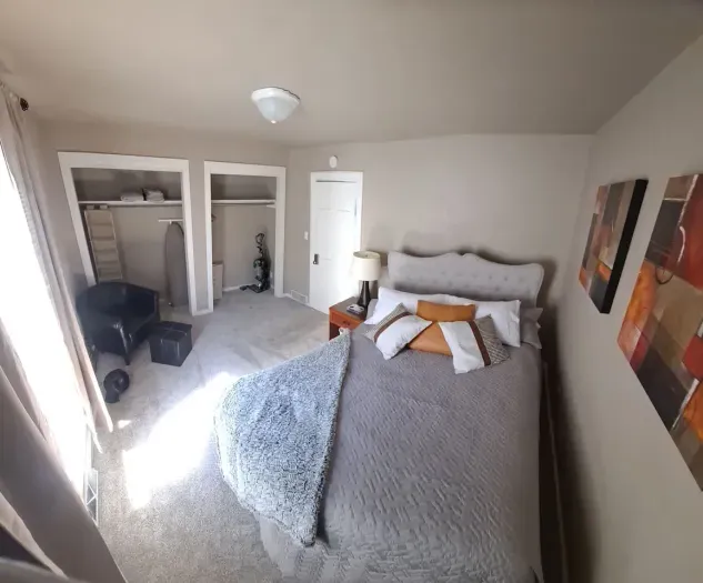 Luxurious master bedroom with a king-size bed for ultimate comfort