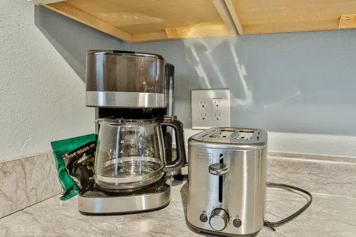 Start your day with the convenience of a kitchen coffee maker and toaster, perfect for easy breakfasts and fresh coffee.