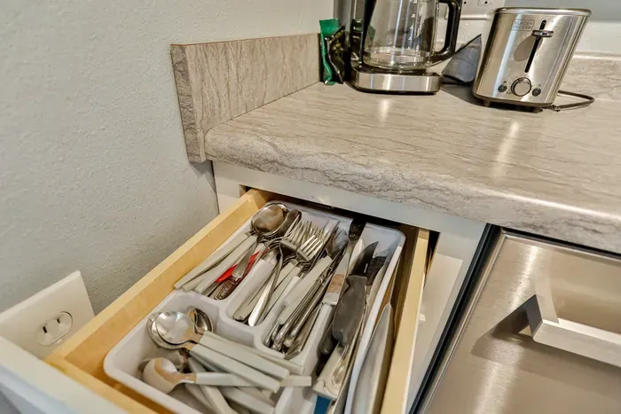 Enjoy the convenience of stocked kitchen utensils and silverware, ready for easy meals throughout your stay.