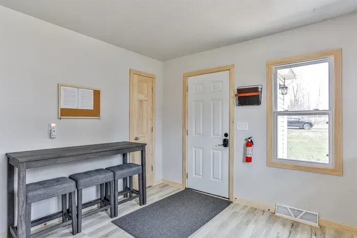 Spacious kitchen with dining setup, perfect for home-cooked meals.