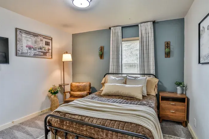 Relaxing bedroom space with modern decor, comfy mattress, and serene atmosphere.