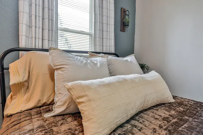 Peaceful bedroom getaway with cozy interiors and everything you need for a good night’s sleep.