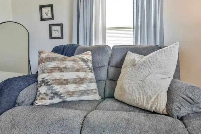 Minimalist living area with clean design and comfy seating.