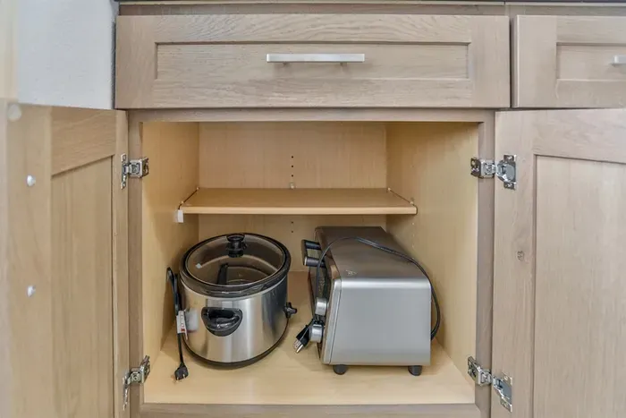 Well-equipped kitchen with cookware, utensils, and modern appliances.