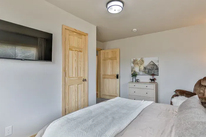 Comfortable private bedroom with natural light, fresh linens, and a cozy feel.
