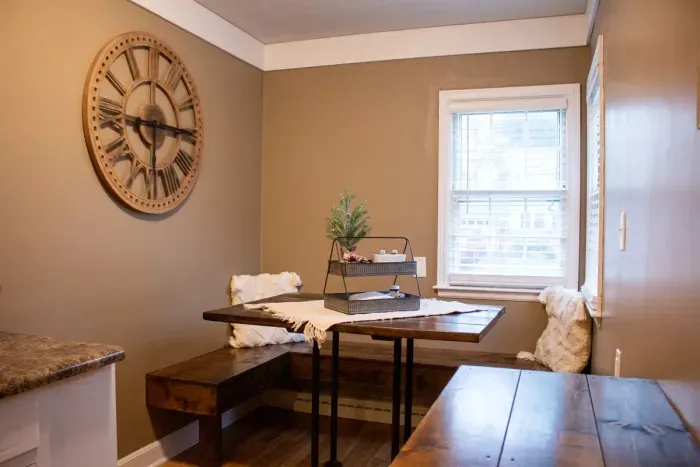 Modern and efficient—everything you need to create a delicious meal. The kitchen features a stainless steel refrigerator, stove, coffee maker, kitchenette oven, kettle, and blender