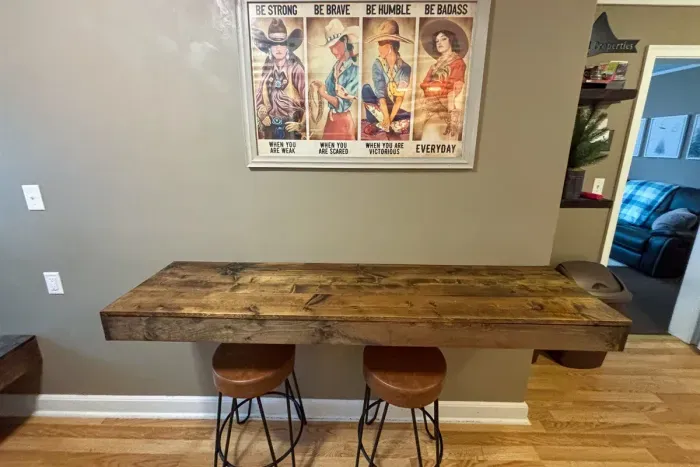 Modern and efficient—everything you need to create a delicious meal. The kitchen features a stainless steel refrigerator, stove, coffee maker, kitchenette oven, kettle, and blender