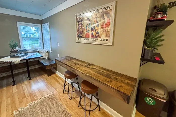 Modern and efficient—everything you need to create a delicious meal. The kitchen features a stainless steel refrigerator, stove, coffee maker, kitchenette oven, kettle, and blender