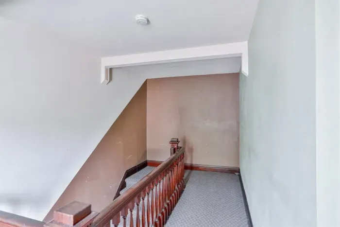 Modern and efficient—everything you need to create a delicious meal. The kitchen features a stainless steel refrigerator, stove, coffee maker, kitchenette oven, kettle, and blender.