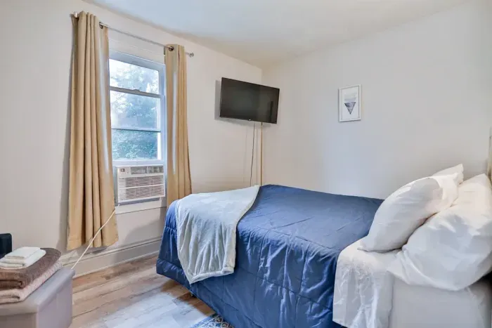 Luxurious master bedroom with a king-size bed for ultimate comfort