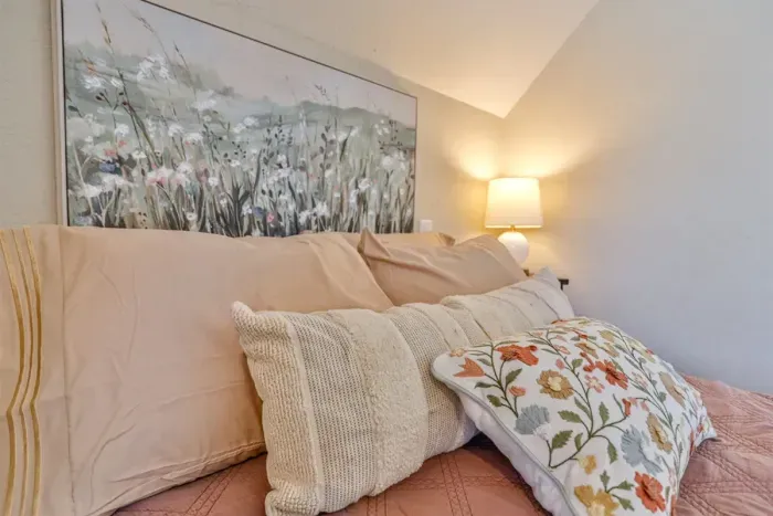 Rich textures and gentle lighting give the room a sophisticated look while maintaining a warm, comfortable ambiance.