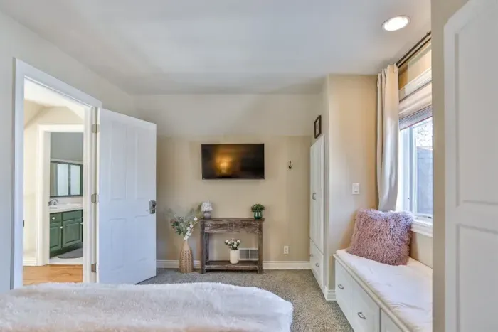 Textured finishes and soft lighting create a welcoming and relaxing environment.