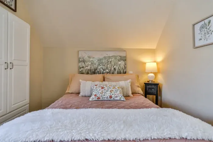 A cozy and inviting bedroom, carefully curated to provide a calm, restful space for your stay.