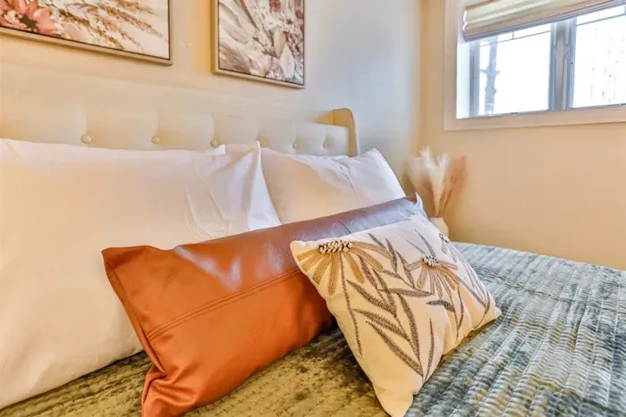 Layered textures and soft lighting create an elegant yet cozy atmosphere, making the space feel both stylish and relaxing.