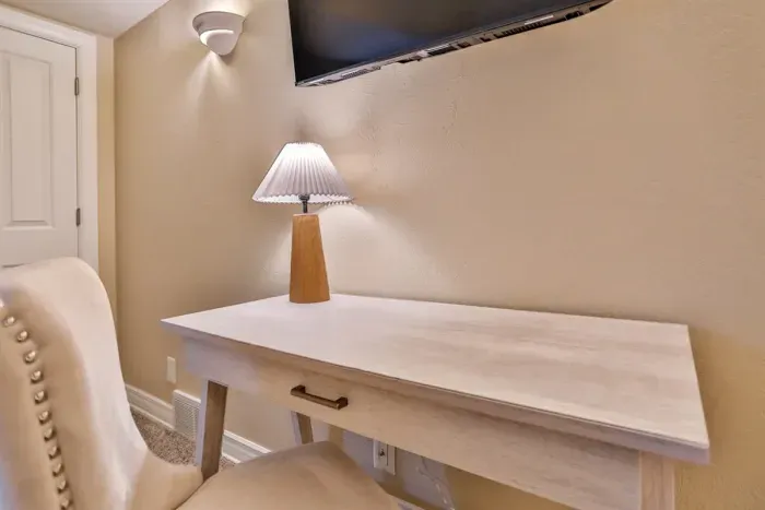 Dedicated workspace for work or relaxation. The bedroom features a stylish desk paired with a comfortable chair, creating a cozy and functional spot for remote work, journaling, or planning your day.