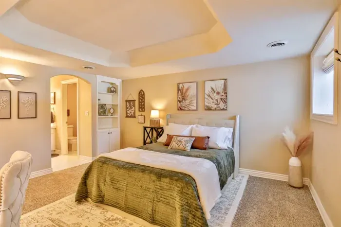 Sleep in style and comfort in this beautifully designed modern bedroom. Set against warm cream walls, the space feels light, calm, and inviting perfect for unwinding after a day of exploring.