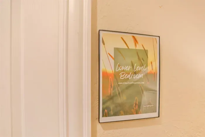 The lower-level bedroom is accessed through a private door, offering a quiet and comfortable retreat away from the main living areas.