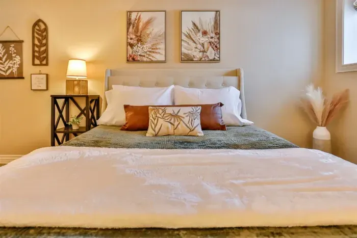 Thoughtfully chosen textures and neutral tones create a clean, elegant look, while soft lighting adds a cozy, relaxing ambiance. Ideal for guests who appreciate modern comfort with a touch of understated luxury.