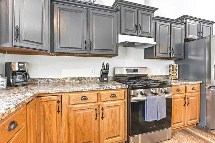 Enjoy a stylish kitchen setup with spacious counters, modern appliances, and a relaxed connection to the outdoors.