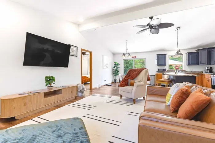Gather in a sunlit living space where soft textures, modern comfort, and a calm connection to nature make every moment feel effortless.
