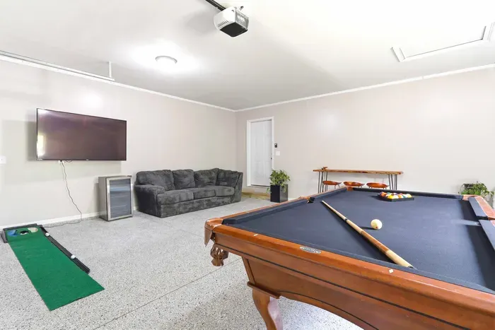 Enjoy friendly competition and laid-back downtime with a pool table, cozy seating, and plenty of room to relax.