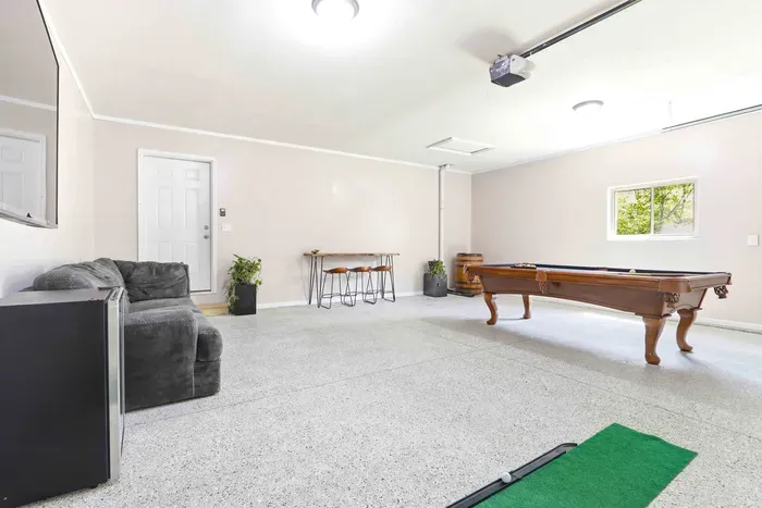 Play, lounge, and unwind in a spacious game room designed for easygoing fun after a day outdoors.