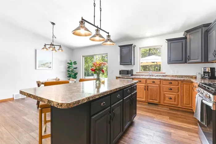 Enjoy casual meals and effortless hosting in an open kitchen and dining space filled with natural light.