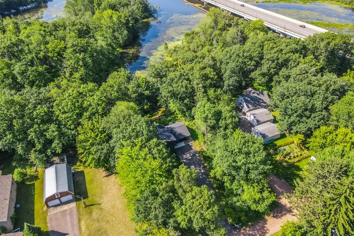 Set near the river and framed by trees, this home invites you to unwind in a truly scenic setting.