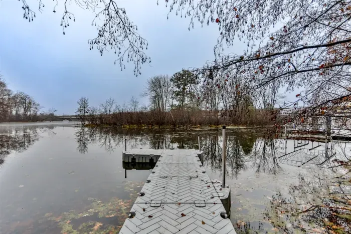 Private dock with boat slip, perfect for kayaking, fishing, or simply enjoying the serene waterfront views.