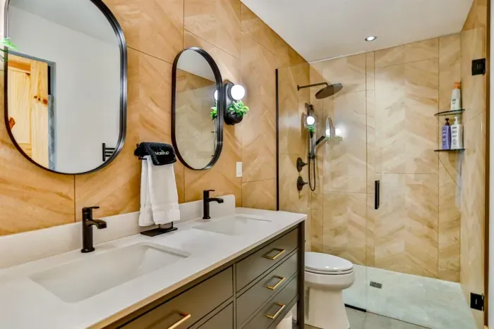 Bright, well-stocked bathroom with towels, and thoughtful touches.