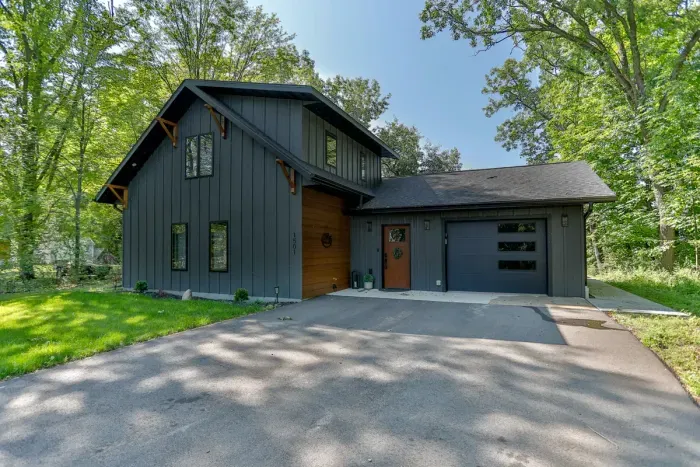Enjoy a serene arrival surrounded by lush greenery, with a spacious private driveway leading to your getaway.