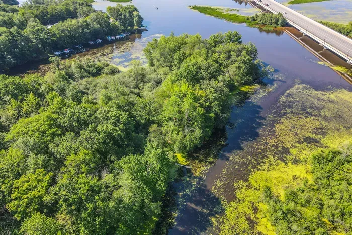 Take in sweeping waterfront views from above, surrounded by lush greenery and peaceful natural beauty.