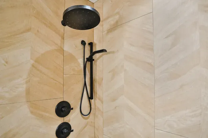 Clean, modern shower with hot water and provided essentials for a comfortable stay.