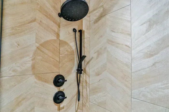 Clean, modern shower with hot water and provided essentials for a comfortable stay.