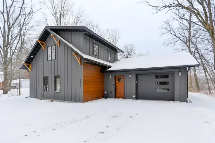 Winter-ready 3BR home with cozy living spaces, beautiful snow-covered views, and private dock access.