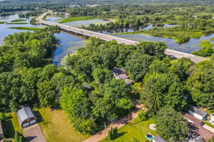 Surrounded by greenery and open water, this retreat offers a serene sense of privacy from above.