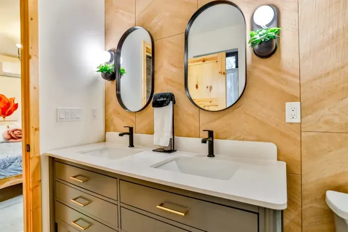 Fresh towels, extra storage, and a clean design make this bathroom both functional and inviting.